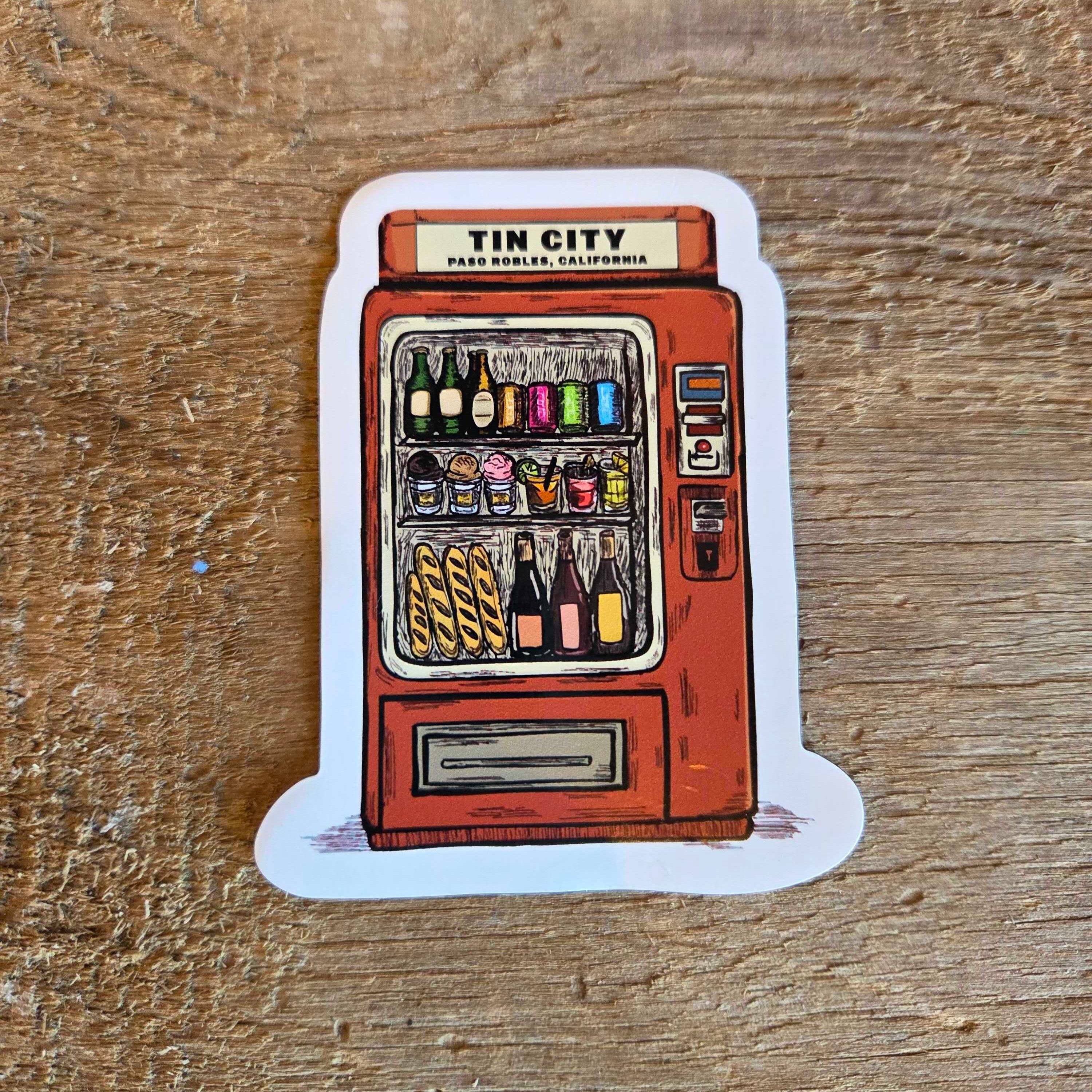 Magnet of a vintage vending machine on a wooden surface